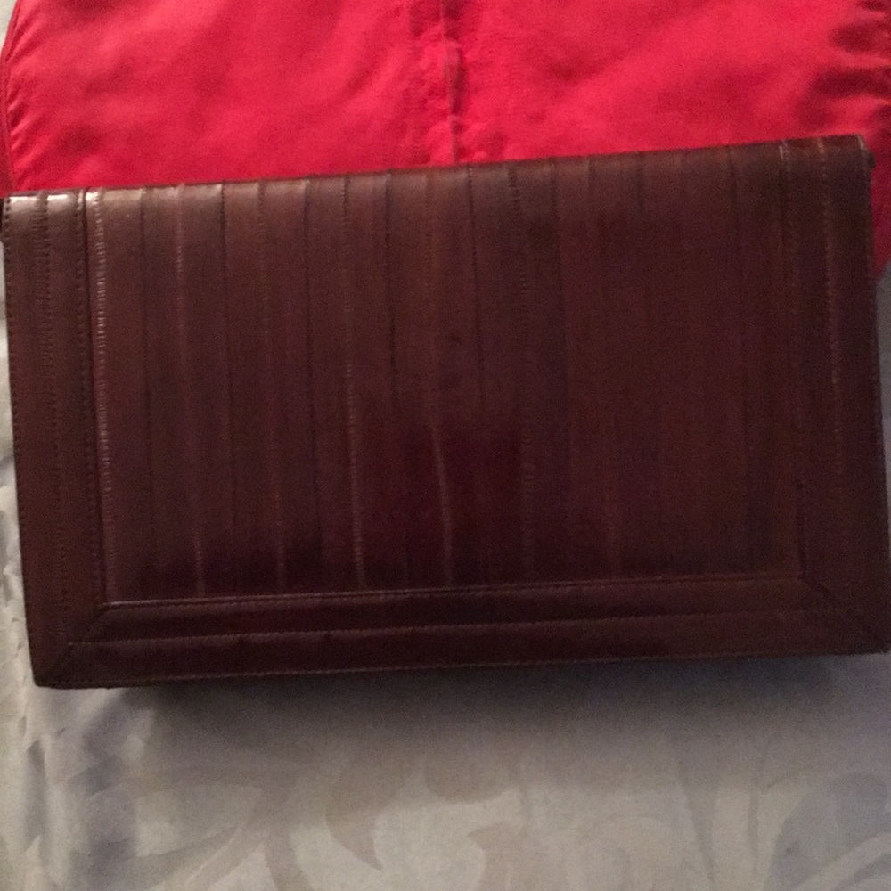 Beautiful leather clutch with strap inside or out!
